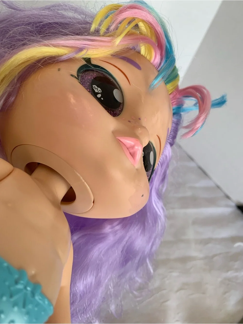 Kindi Kids Rainbow Kate doll with pastel hair and large glitter eye